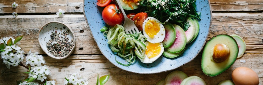 Fresh vegetables, salads and healthy foods arranged beautifully