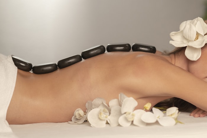 Person resting comfortably in a relaxed, reclined wellness setting